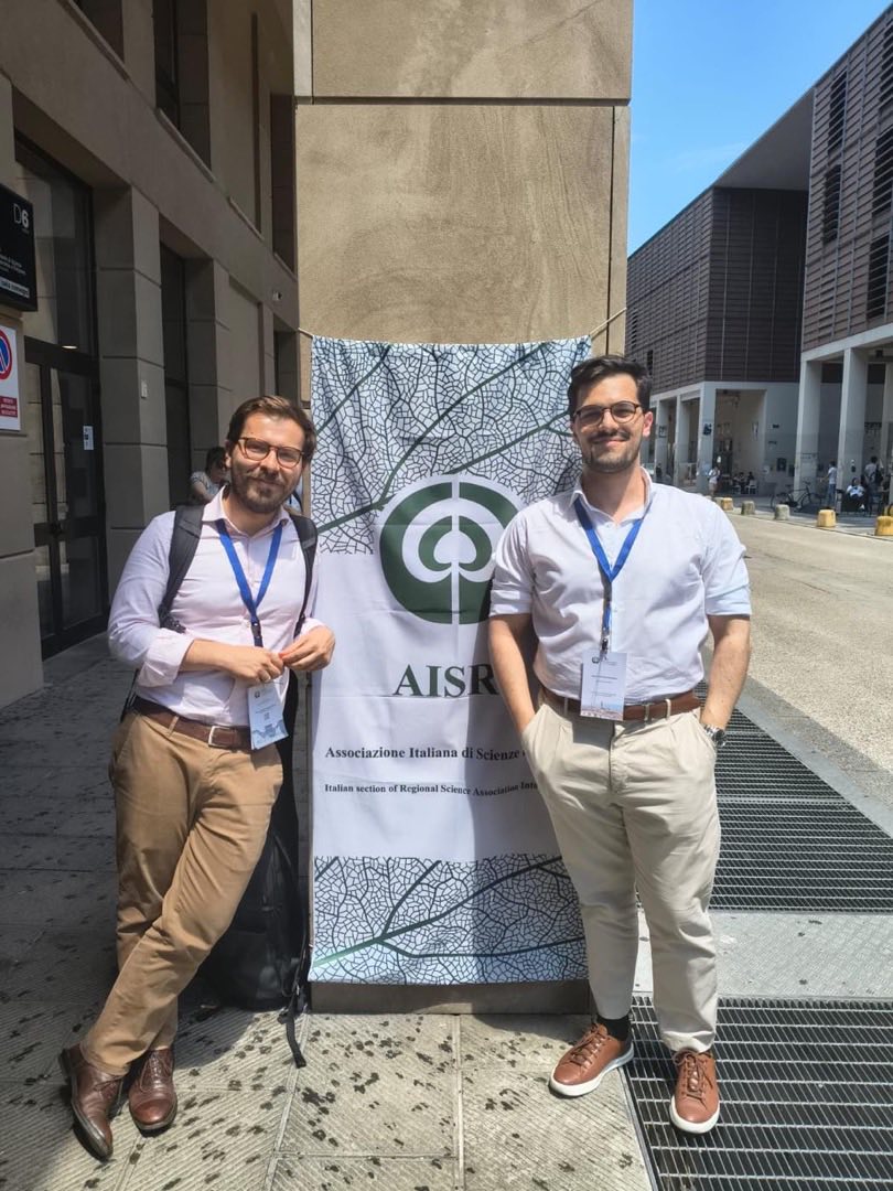 Al banner dell'Associazione Italiana di Scienze Regionali, Campus di Novoli, Firenze, giugno 2026